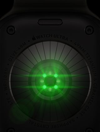 Apple Watch Ultra 4 aizmugure, titāna ietvars, melns, vairāki apaļi sensori ar zaļi mirdzošām LED gaismām