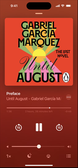 iPhone screen showing an audiobook. Below the cover art is playback controls, including a play button, volume slider, and “jump ahead” and “jump back” buttons