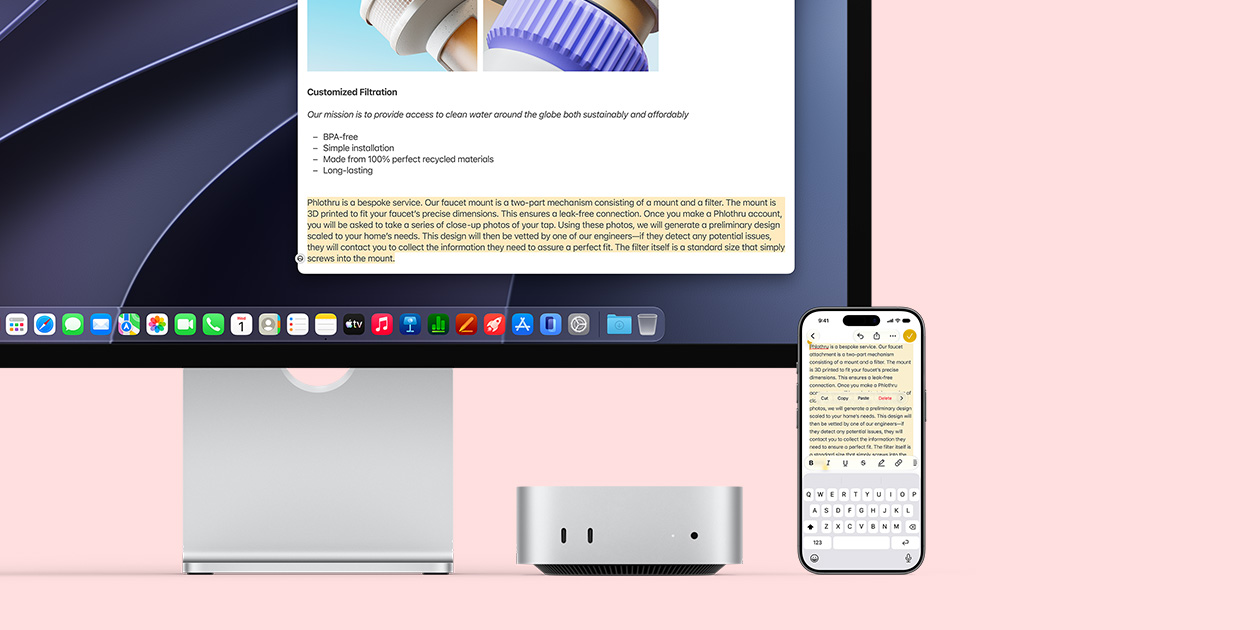 Mac mini front, tucked under Studio Display, an iPhone sits to the right of the device and the display, text selected with cut, copy, paste, and AutoFill commands above on iPhone matches highlighted text on display, showcasing Universal Clipboard