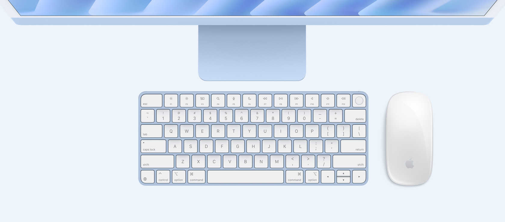 Vedere de deasupra a unui iMac Albastru cu tastatură și mouse în culori asortate