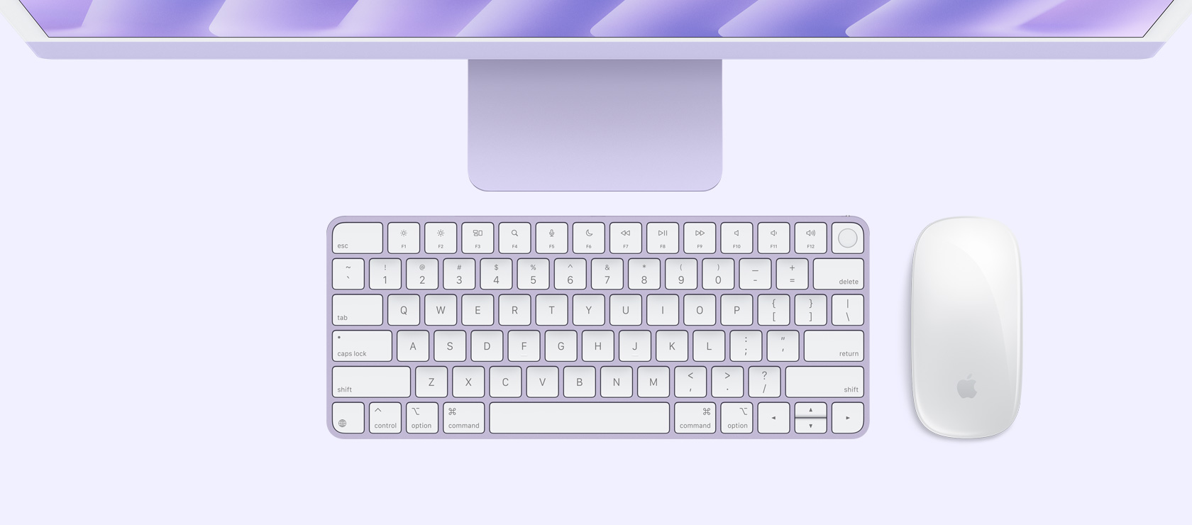 Vedere de deasupra a unui iMac Violet cu tastatură și mouse în culori asortate