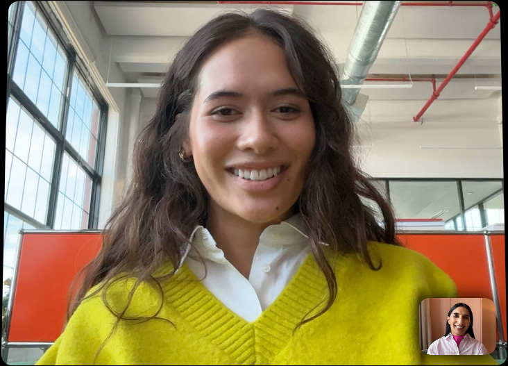 iPad Pro attached to Magic Keyboard, open front exterior, display showing a FaceTime call in full screen, highlighting the pro camera system