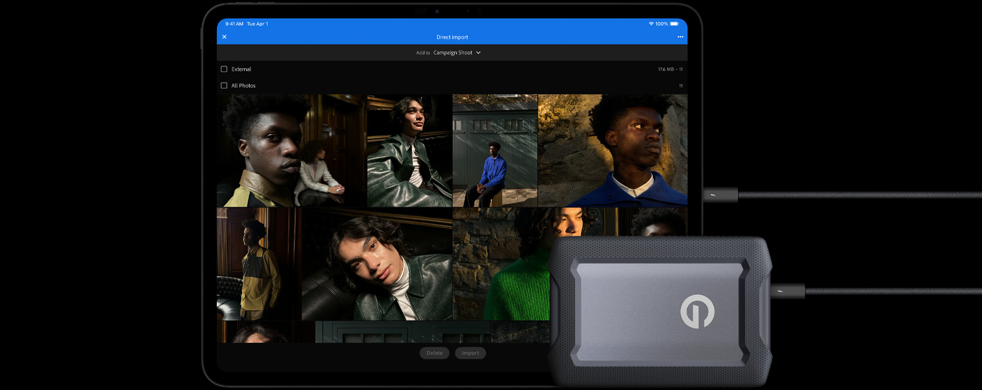 iPad Pro, front exterior, landscape orientation, space black color, connected with a cable to a USB-C external hard drive, display showing photos of models being imported to a folder called 'Campaign Shoot'