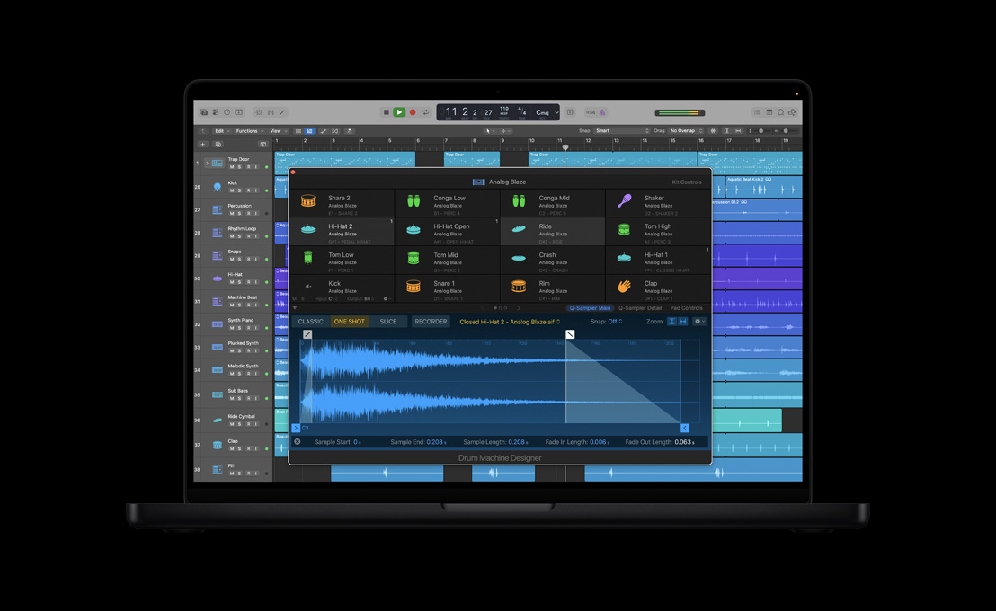 MacBook Pro 16 screen showing Drum Machine Designer, kit controls, Analog Blaze window with sound waves and four rows of various instruments