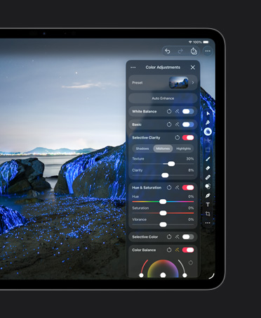 iPad Pro 13 screen, photo of boulders on beach with blue glows, color adjustments tools