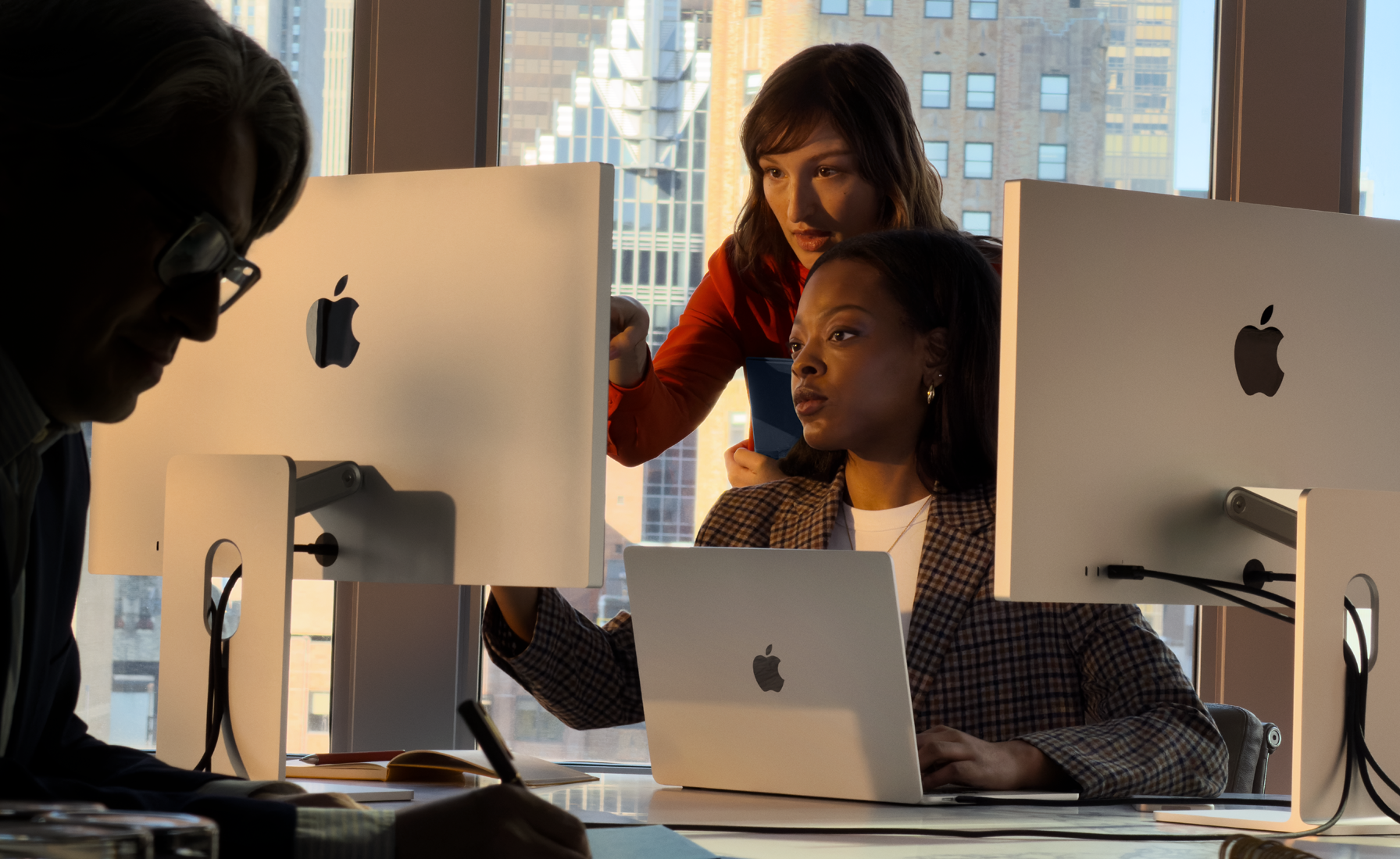 People using Mac in a work setting